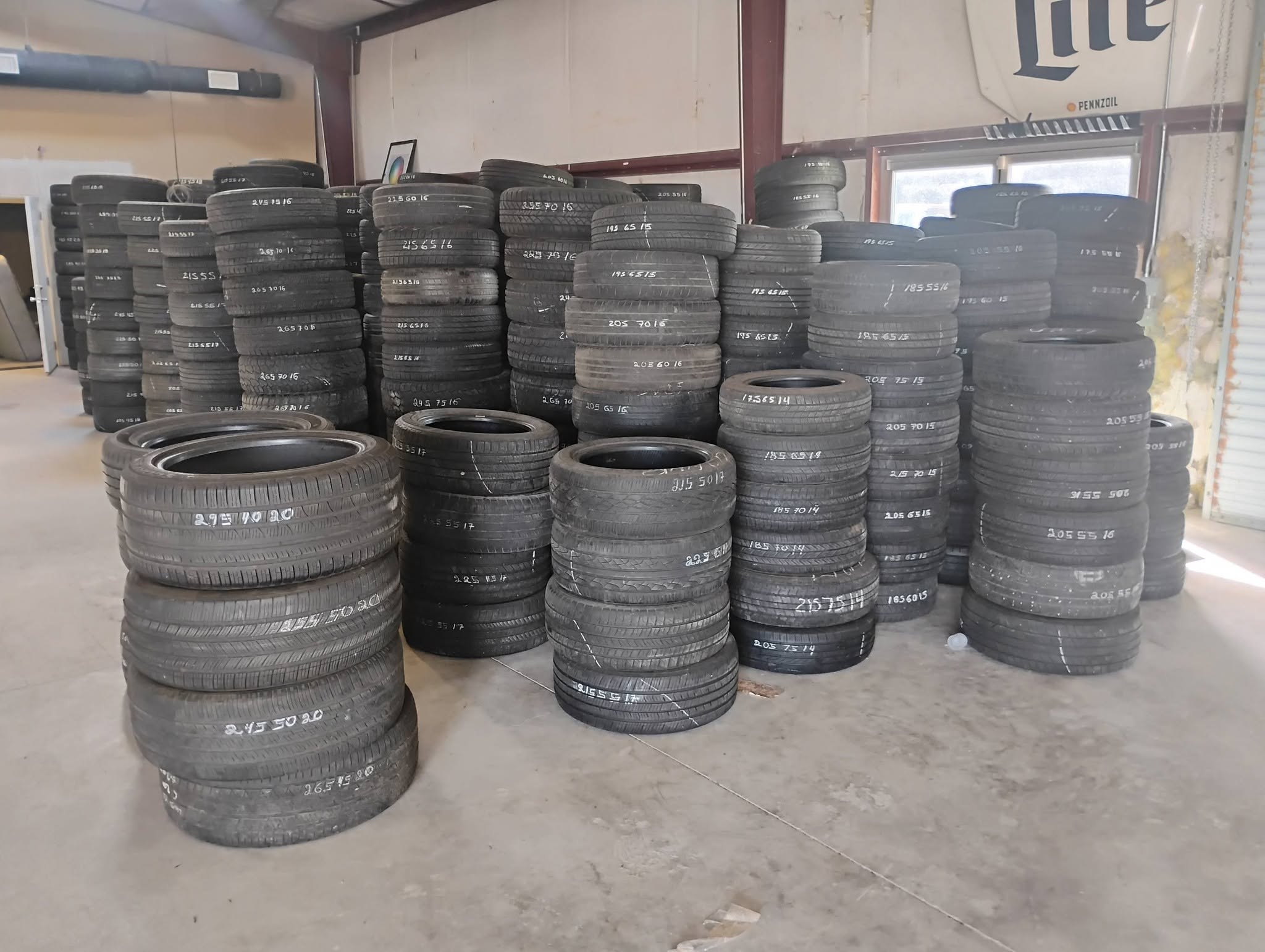 Stacks of used tires in stock