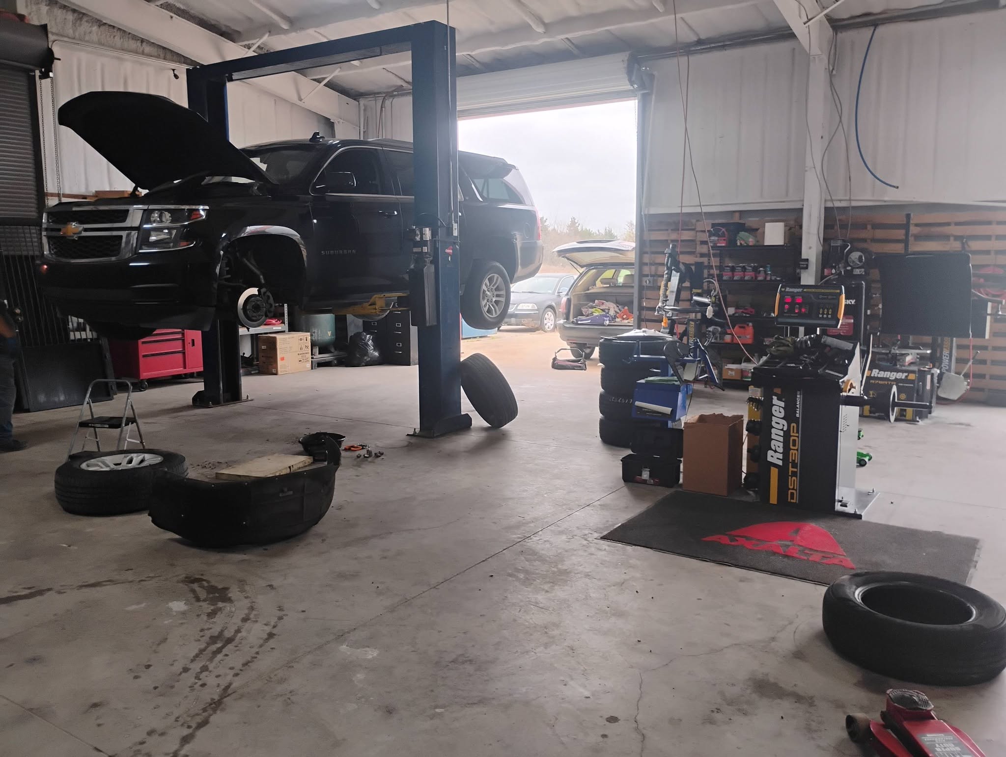 ETC Auto Care shop floor with a vehicle on the lift